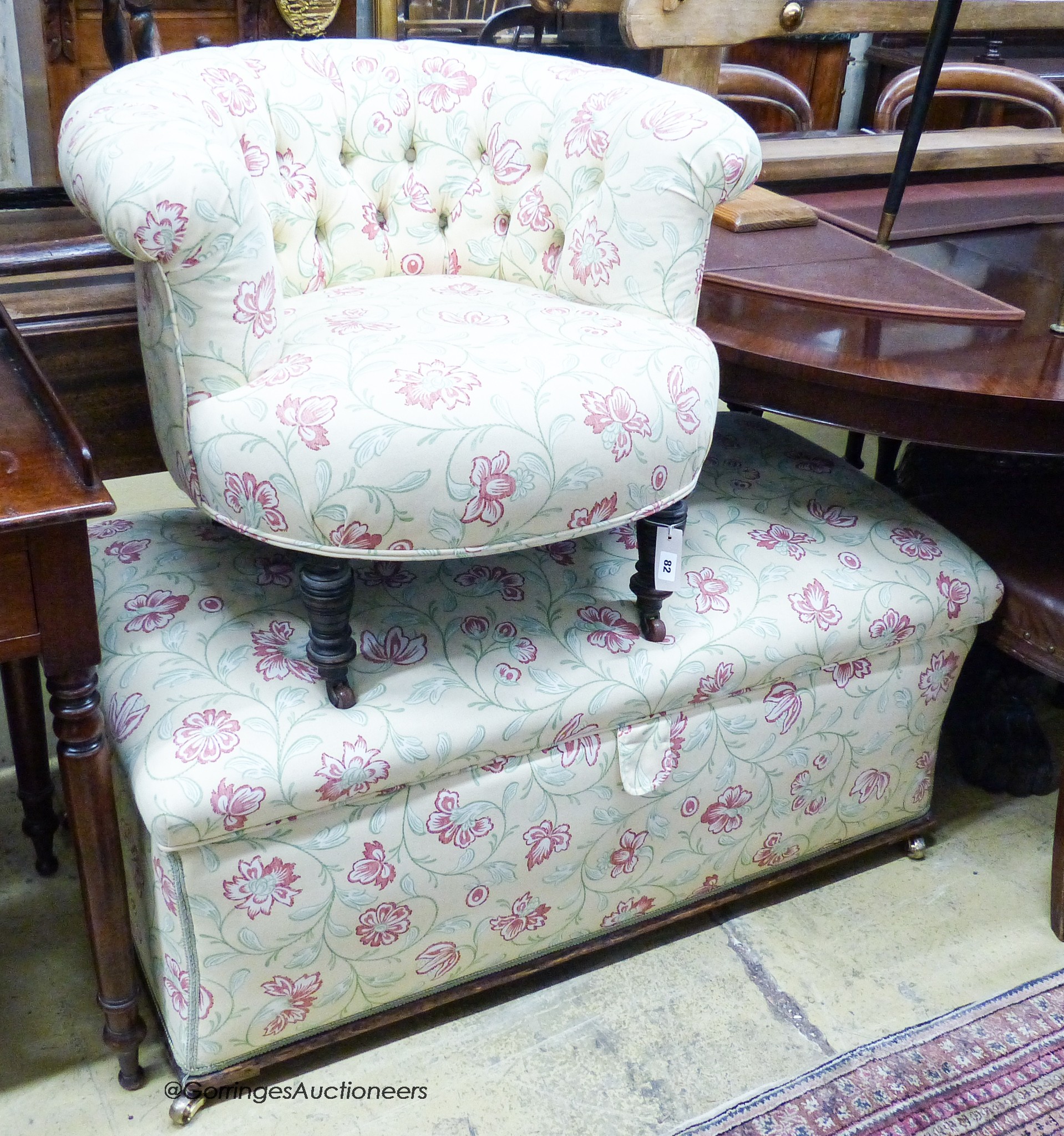 A late Victorian upholstered ottoman, length 112cm, depth 58cm, height 48cm together with a buttoned framed tub chair upholstered in the same fabric